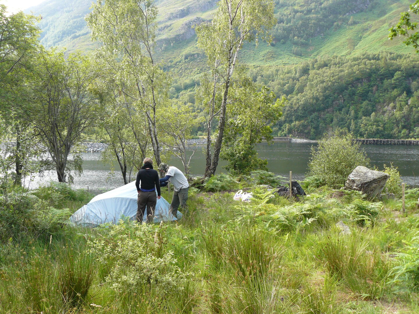 Campsite near Kinlochleven. The fire is supposed to keep the midges away, but I guess they do not know about this. Right photo (c) James Mellors