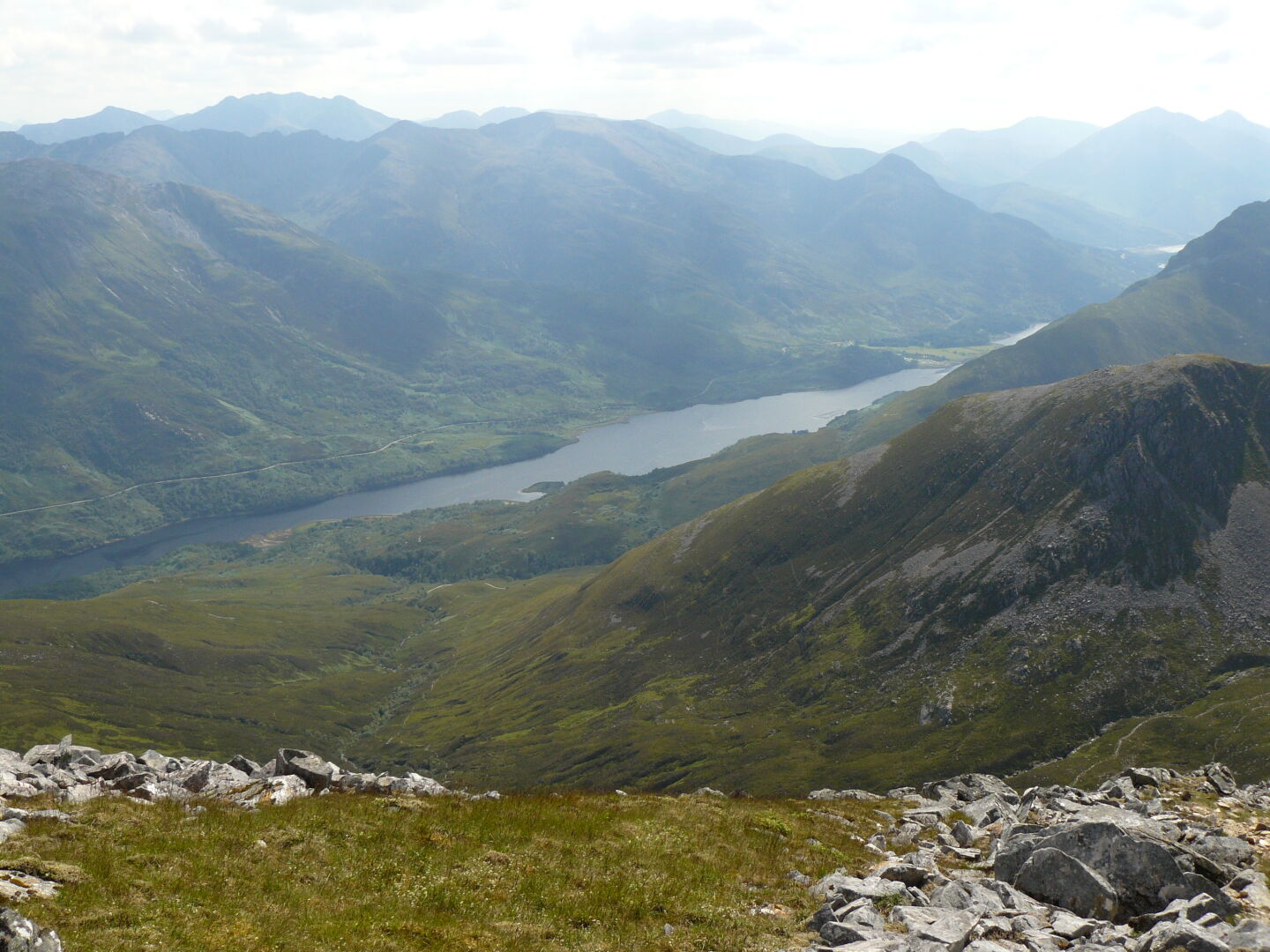 Loch Leven lies far below us to the south, and Ben Nevis in the North. Meandering streams decorate the valleys in between. Right image (c) James Mellors.