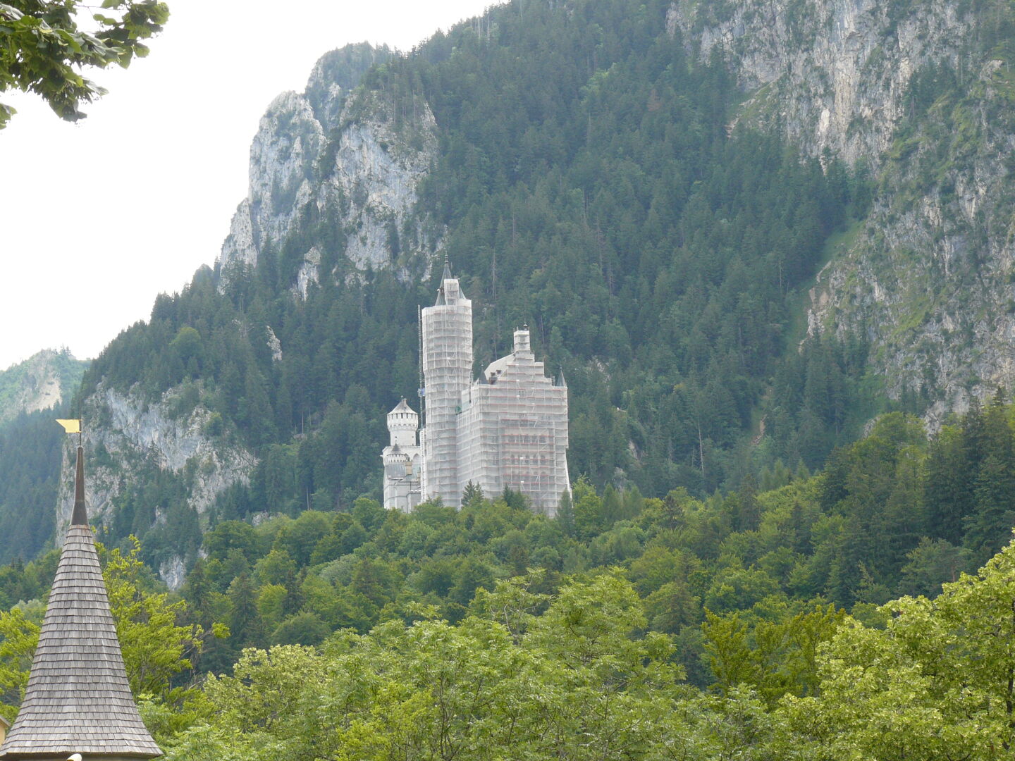 First view of Castle Neuschwanstein in the distance. Apparently the western (my) side is under construction.