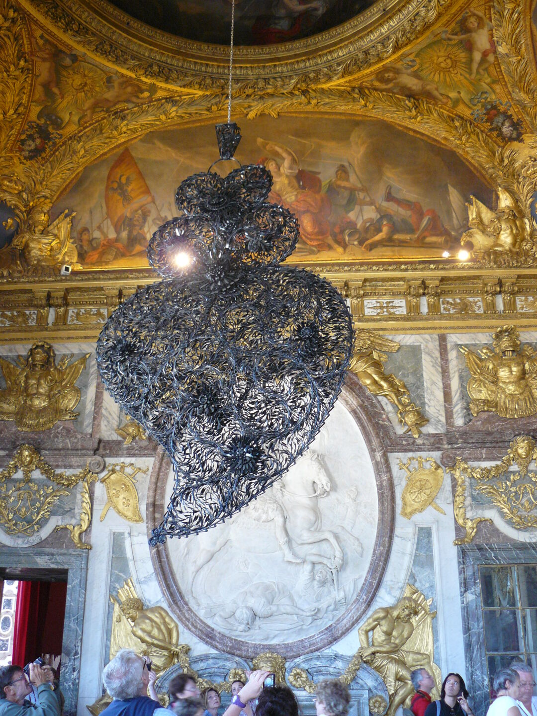 In Versailles, there was an exhibition of portuguese artist Joana Vasconcelos. This item is made from plastic forks and spoons.